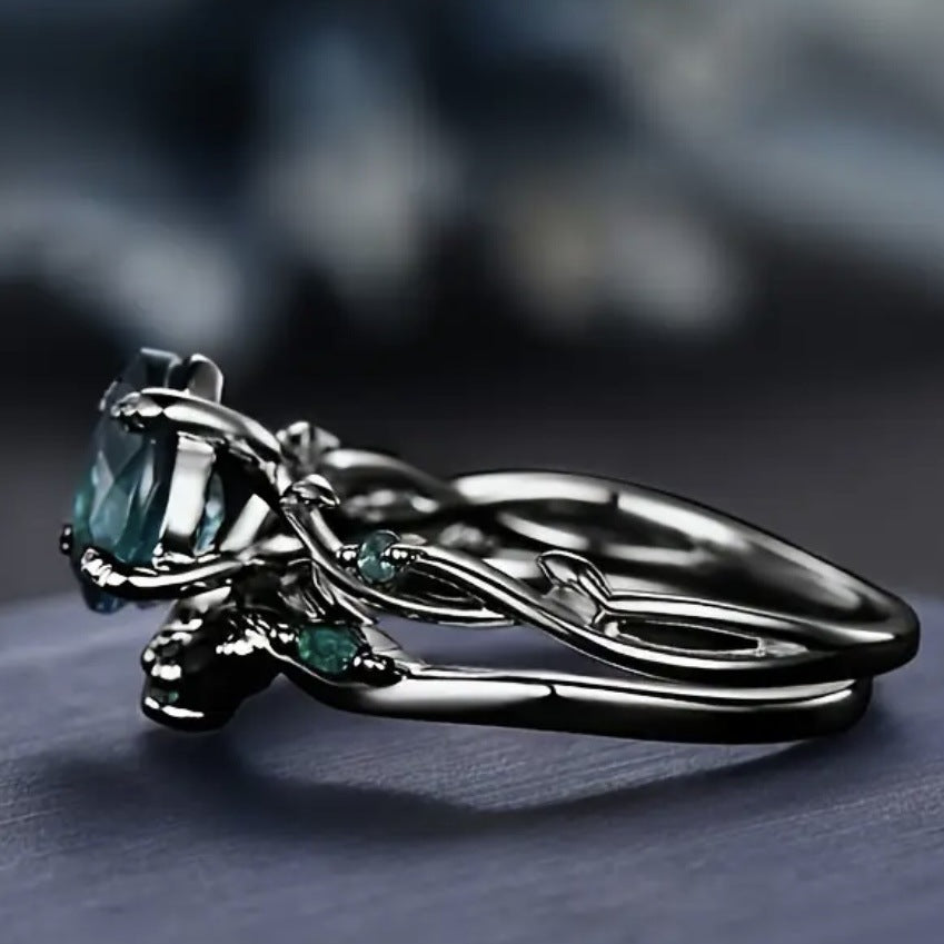 Dark‑Gunmetal Twisted‑Branch Teardrop Green Diamond Women’s Ring