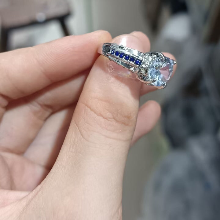 Men’s Four‑Prong Main‑Stone Ring With Blue Sapphire Accents