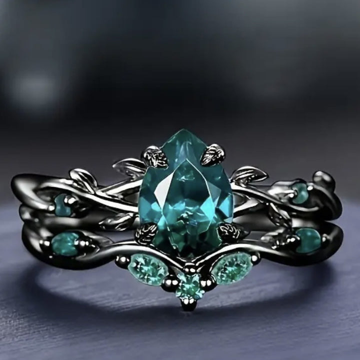 Dark‑Gunmetal Twisted‑Branch Teardrop Green Diamond Women’s Ring