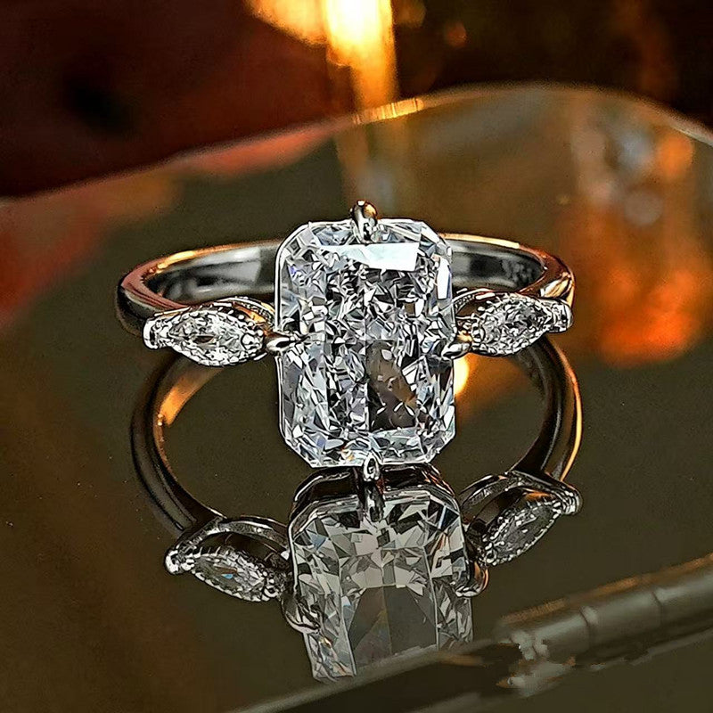 Radiant‑Cut Rectangular Center Diamond Engagement Ring With Marquise Side Diamond, Gold & Silver Options
