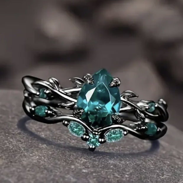 Dark‑Gunmetal Twisted‑Branch Teardrop Green Diamond Women’s Ring