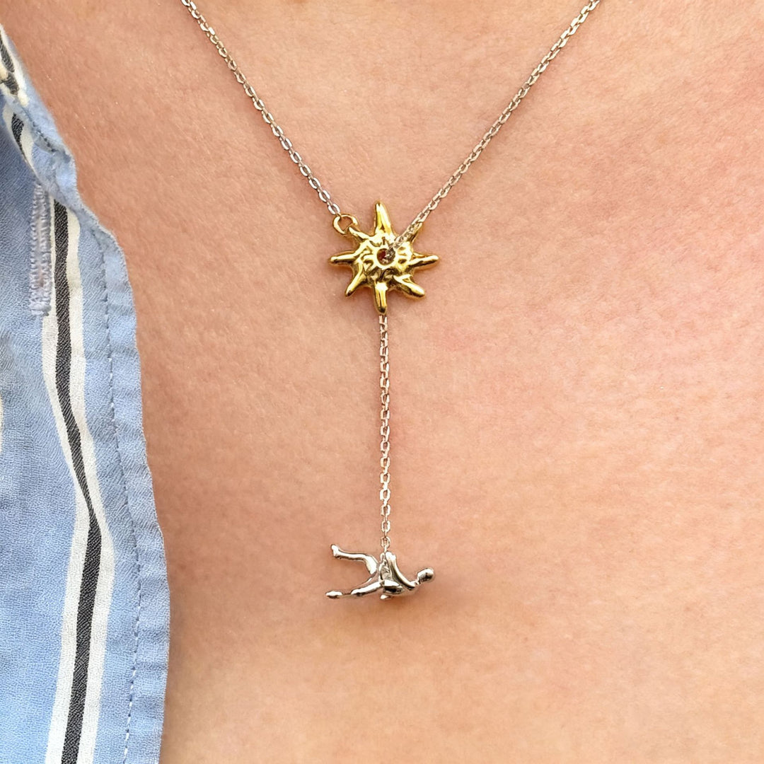 Abstract Star & Falling Figure Pendant Necklace – Minimalist Artistic Chain