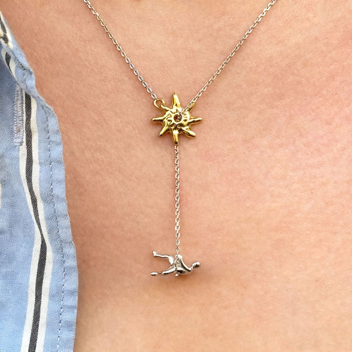 Abstract Star & Falling Figure Pendant Necklace – Minimalist Artistic Chain