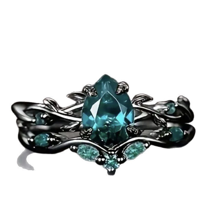 Dark‑Gunmetal Twisted‑Branch Teardrop Green Diamond Women’s Ring
