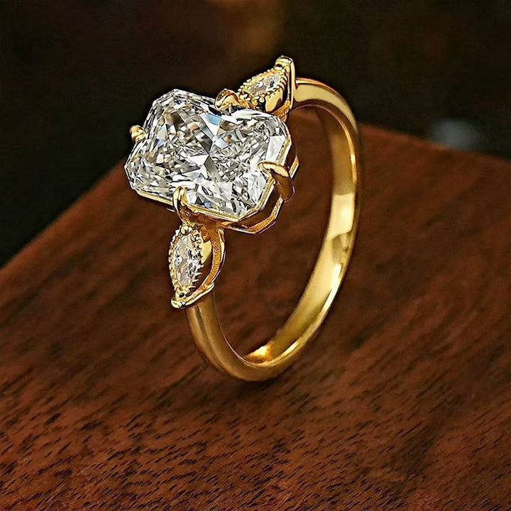 Radiant‑Cut Rectangular Center Diamond Engagement Ring With Marquise Side Diamond, Gold & Silver Options