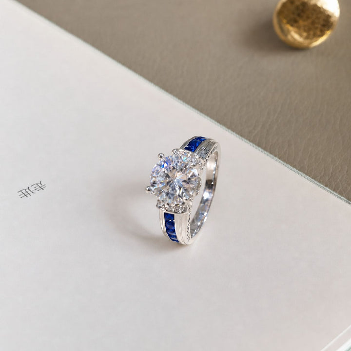 Men’s Four‑Prong Main‑Stone Ring With Blue Sapphire Accents