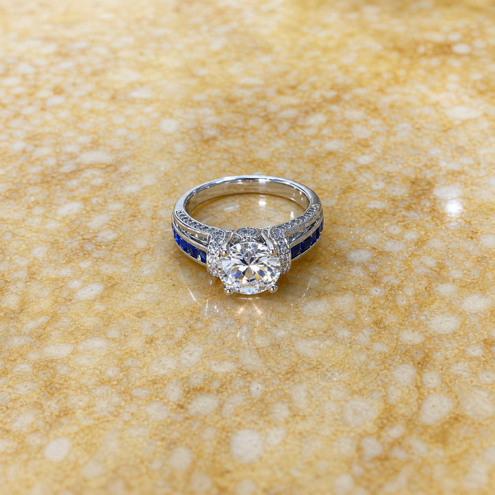 Men’s Four‑Prong Main‑Stone Ring With Blue Sapphire Accents